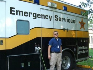 EHS intern in front of ambulance